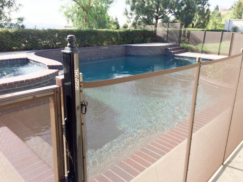 Removable Mesh Fence Securing Pool Area
